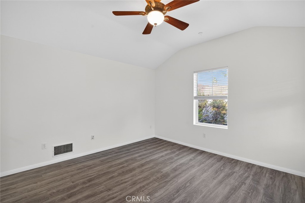 14 Valmont Way Ladera Ranch, CA 92694 - Photo 30 of 39 wooden floor in an empty room with a window