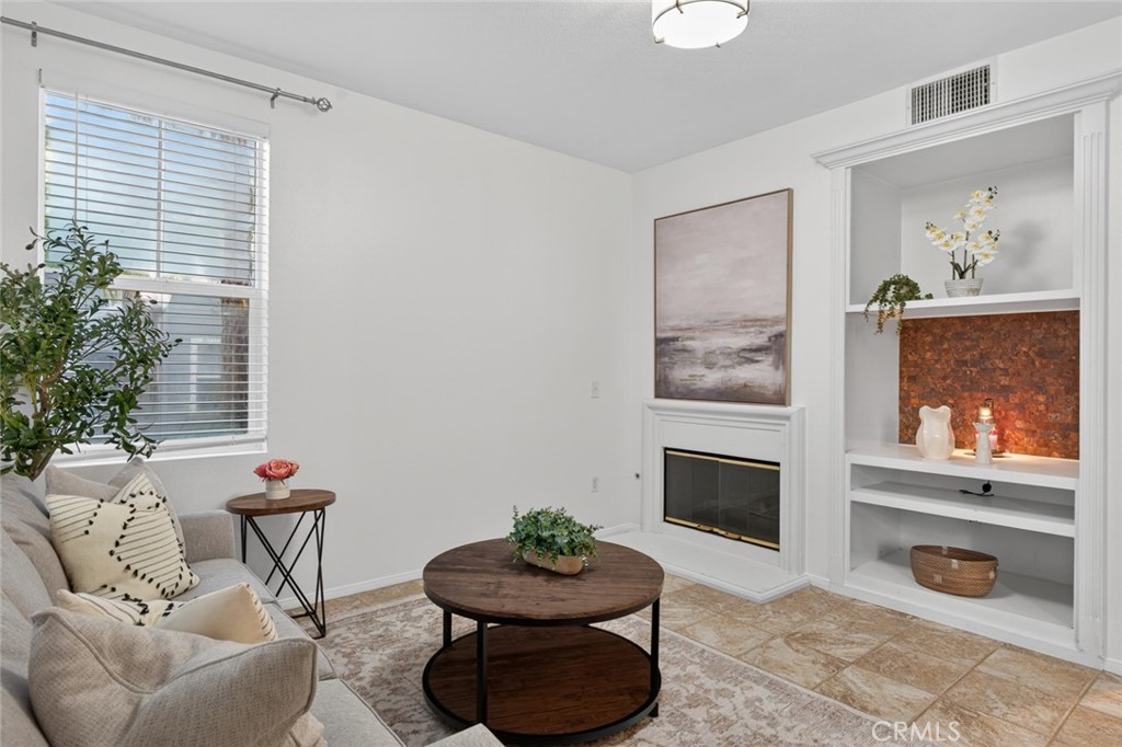 14 Valmont Way Ladera Ranch, CA 92694 - Photo 4 of 39 a living room with furniture and a fireplace