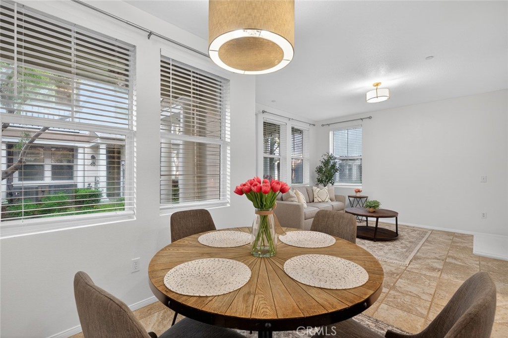 14 Valmont Way Ladera Ranch, CA 92694 - Photo 8 of 39 a view of a dining room with furniture and window