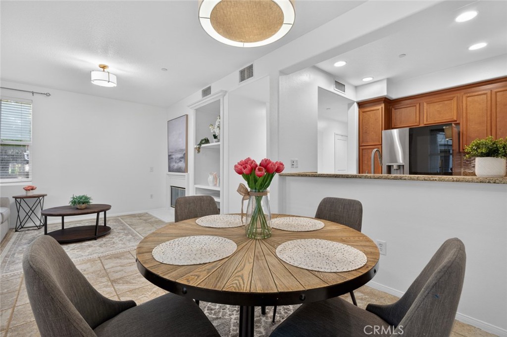 14 Valmont Way Ladera Ranch, CA 92694 - Photo 9 of 39 a dining room with furniture and a chandelier