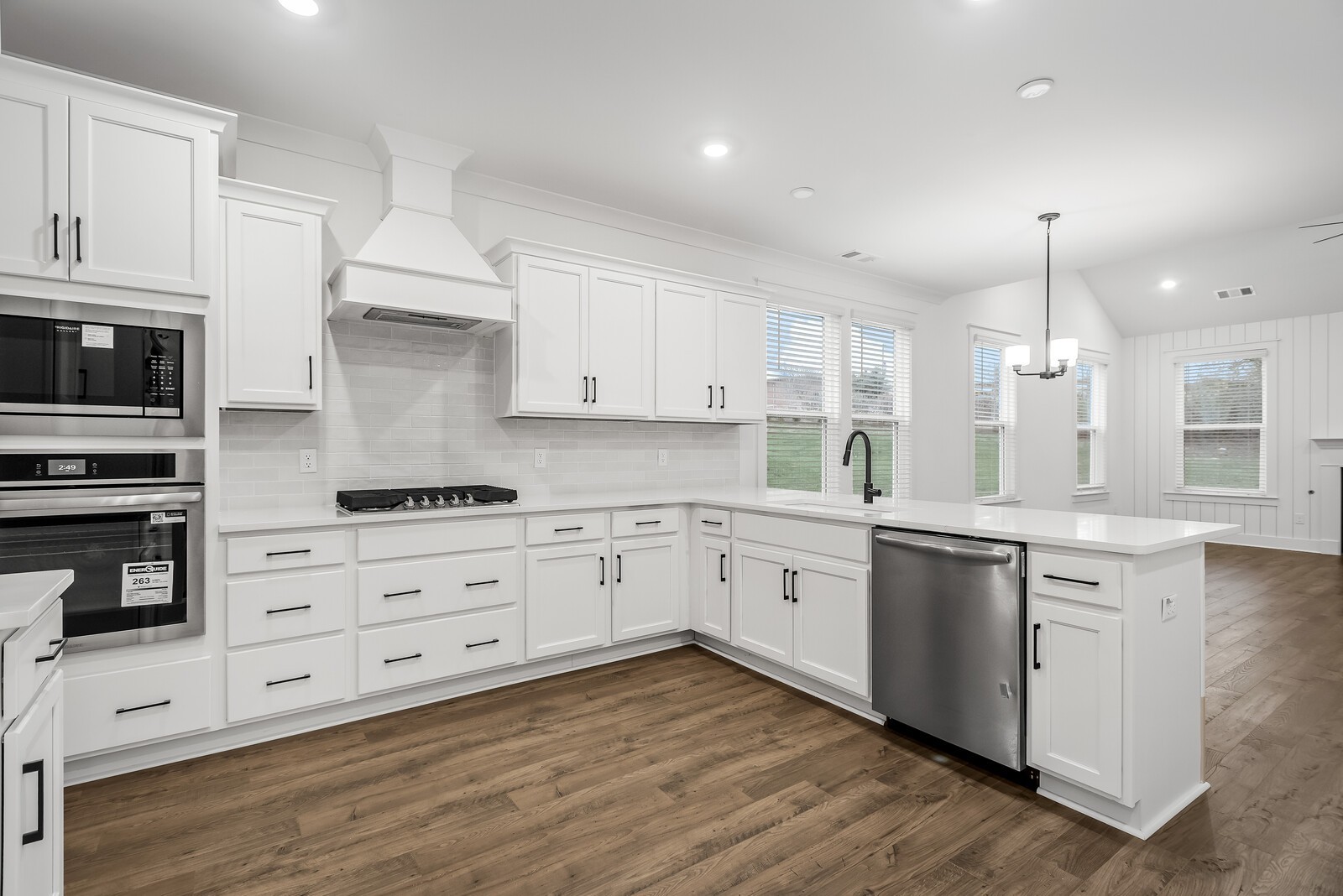 666 Conifer Drive Spring Hill, TN 37174 - Photo 36 of 64 a kitchen with stainless steel appliances granite countertop a stove and white cabinets
