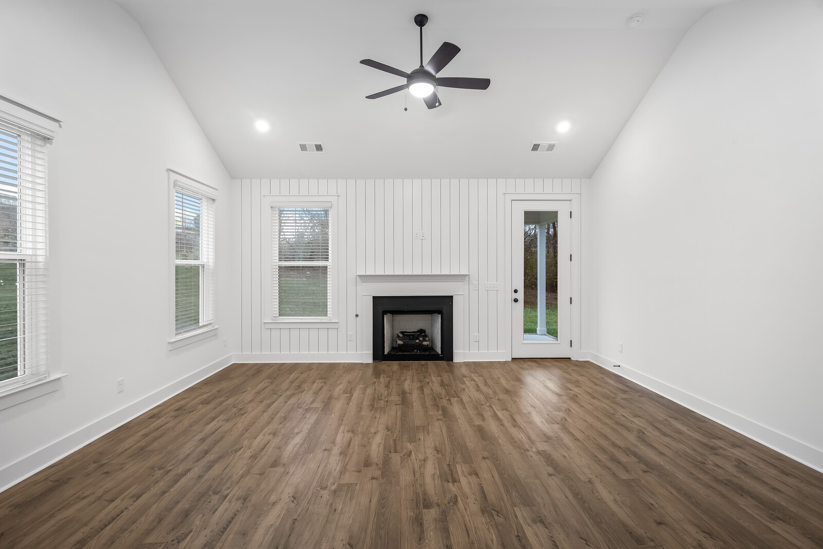 666 Conifer Drive Spring Hill, TN 37174 - Photo 45 of 64 wooden floor fireplace and windows in an empty room