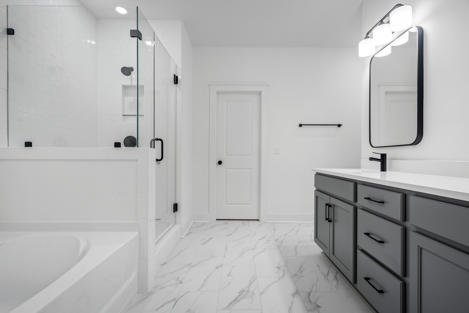 666 Conifer Drive Spring Hill, TN 37174 - Photo 53 of 64 a bathroom with a tub sink and mirror