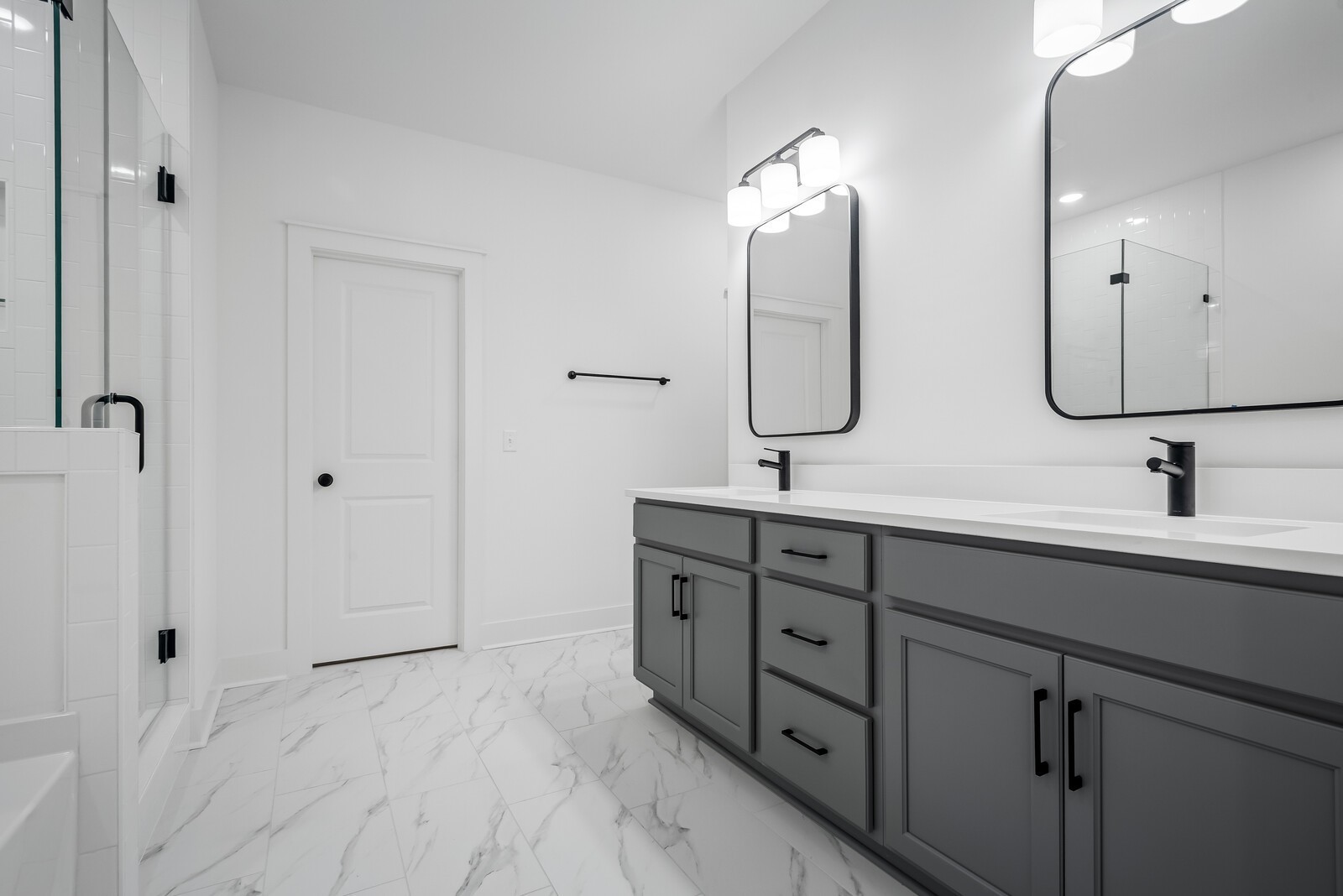 666 Conifer Drive Spring Hill, TN 37174 - Photo 54 of 64 a bathroom with double vanity sinks and a mirror