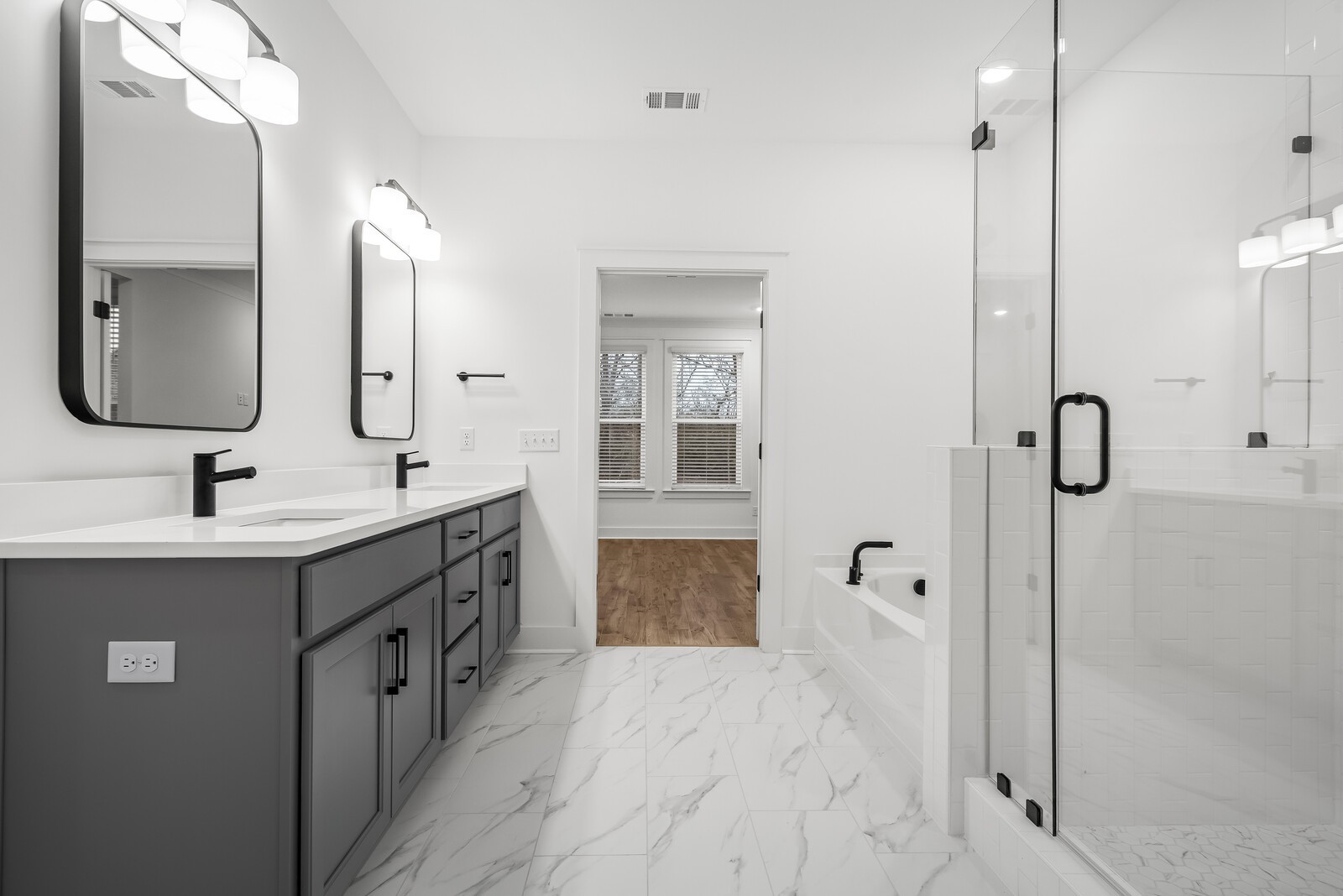 666 Conifer Drive Spring Hill, TN 37174 - Photo 57 of 64 a bathroom with a double vanity sink mirror double and shower