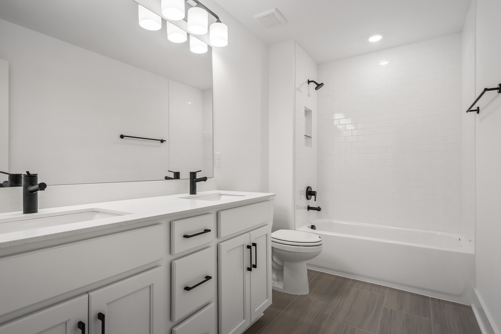 666 Conifer Drive Spring Hill, TN 37174 - Photo 60 of 64 a bathroom with a double vanity sink toilet mirror and shower