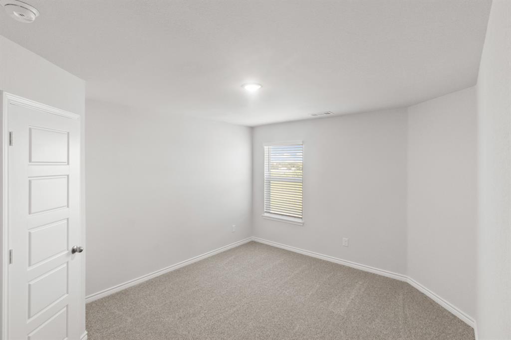 1009 Wind Drift Way Fort Worth, TX 76131 - Photo 13 of 40 an empty room with windows