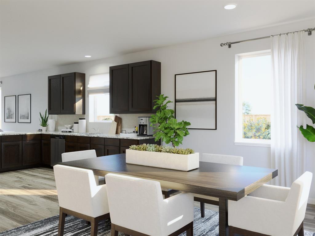 1009 Wind Drift Way Fort Worth, TX 76131 - Photo 26 of 40 a kitchen with a table and chairs in it