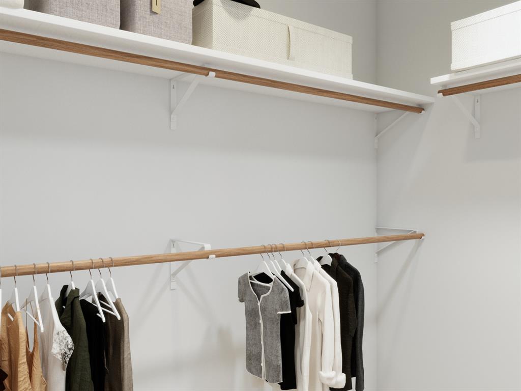 1009 Wind Drift Way Fort Worth, TX 76131 - Photo 30 of 40 a view of walk in closet with clothes and shoes