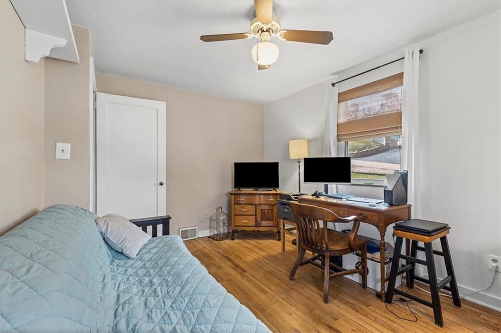 213 Logan Road Bethel Park, PA 15102 - Photo 13 of 47 a bedroom with furniture and a flat screen tv