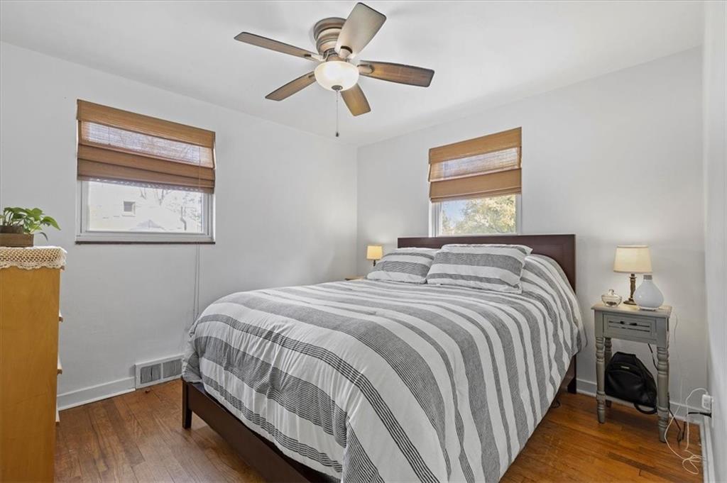 213 Logan Road Bethel Park, PA 15102 - Photo 14 of 47 a bedroom with a bed and a chandelier