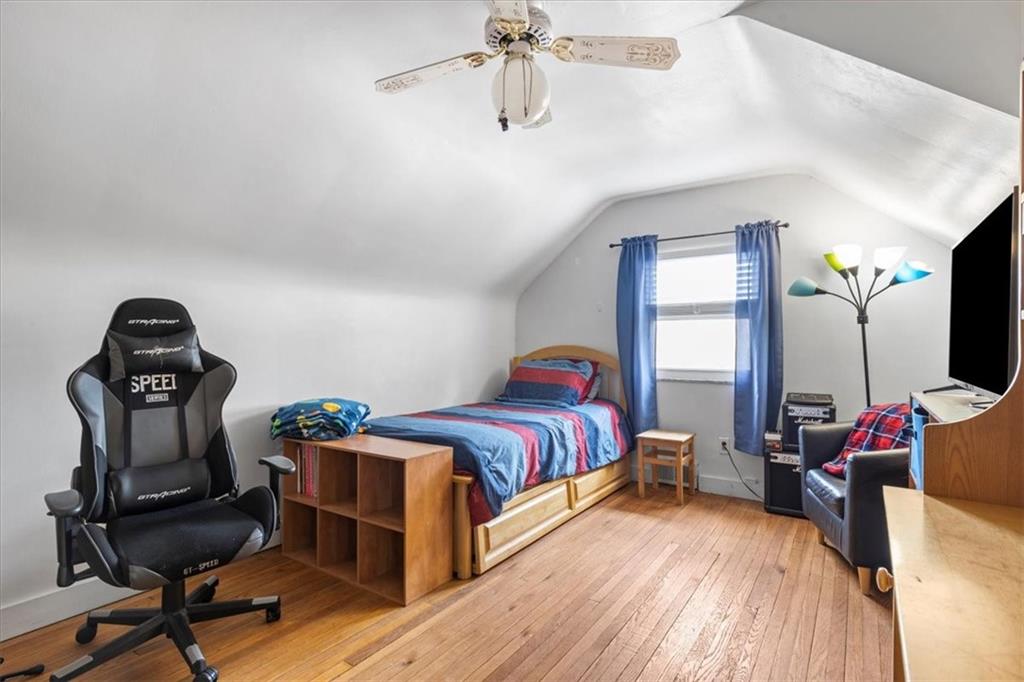 213 Logan Road Bethel Park, PA 15102 - Photo 20 of 47 a bedroom with a bed and a chandelier