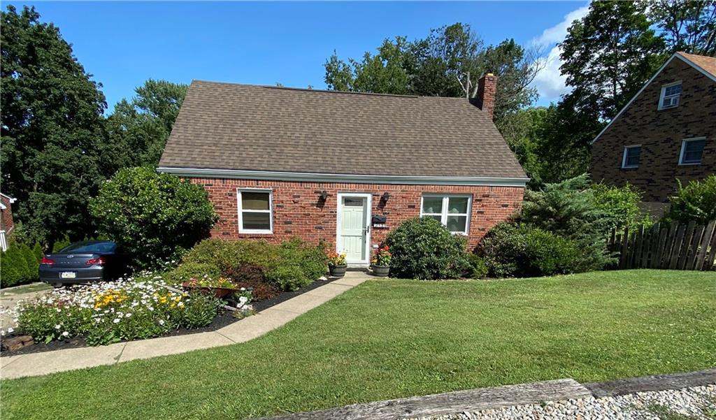 213 Logan Road Bethel Park, PA 15102 - Photo 2 of 47 a front view of a house with a yard