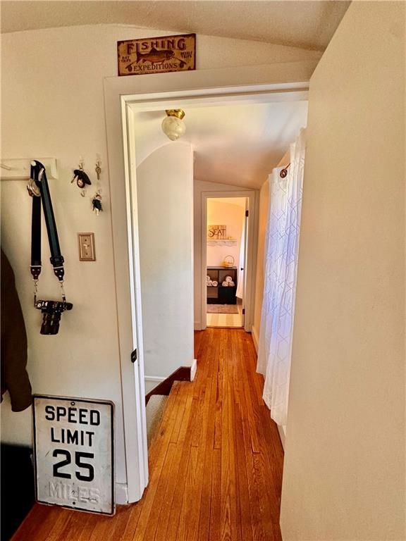 213 Logan Road Bethel Park, PA 15102 - Photo 27 of 47 a view of a hallway with wooden floor and a bathroom