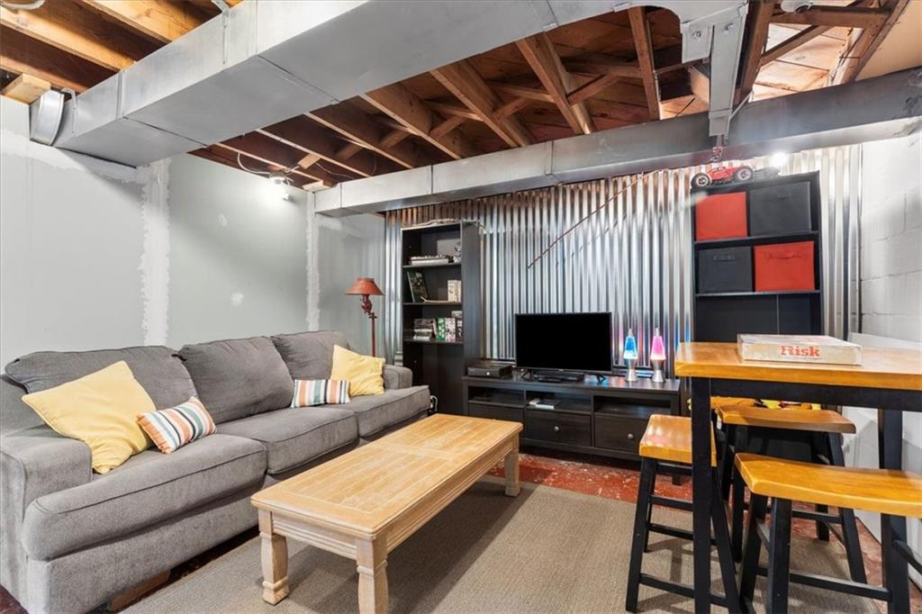 213 Logan Road Bethel Park, PA 15102 - Photo 30 of 47 a living room with furniture and a flat screen tv