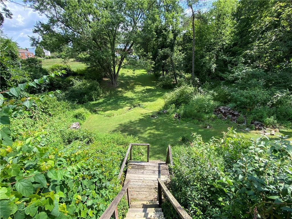 213 Logan Road Bethel Park, PA 15102 - Photo 33 of 47 a backyard of a house with lots of green space