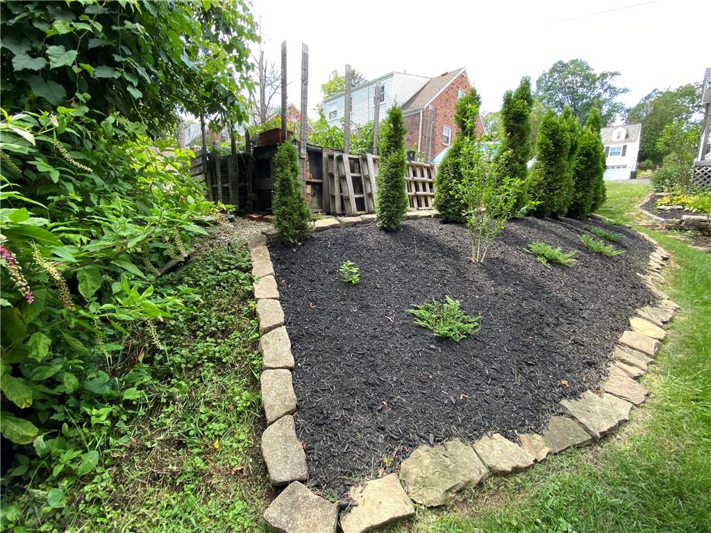 213 Logan Road Bethel Park, PA 15102 - Photo 36 of 47 a view of a garden with a house