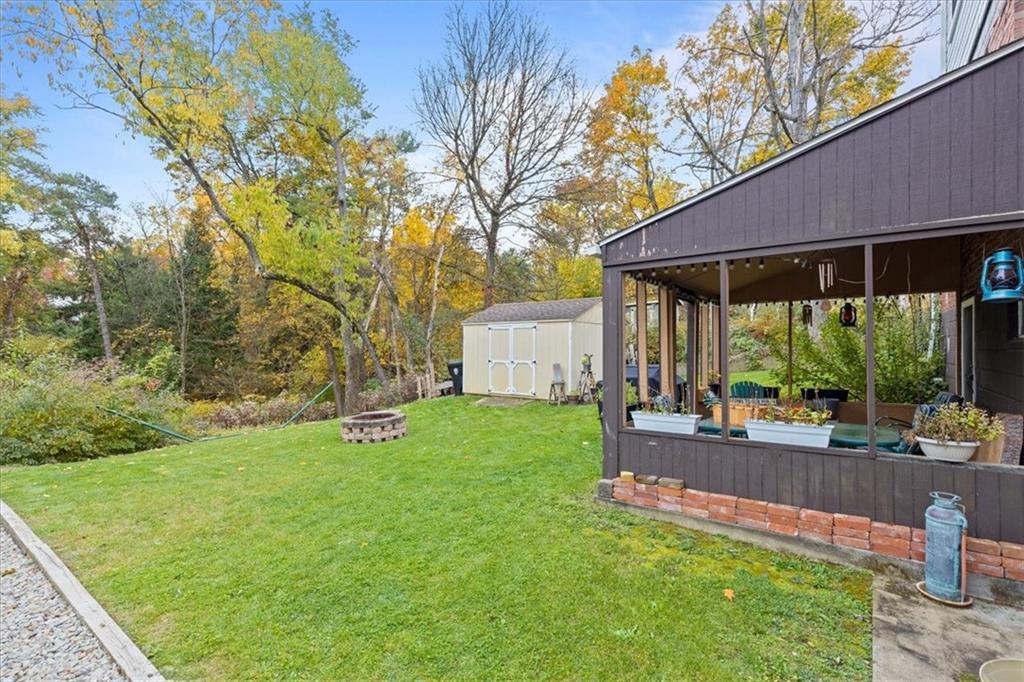 213 Logan Road Bethel Park, PA 15102 - Photo 40 of 47 a view of a patio with table and chairs under an umbrella