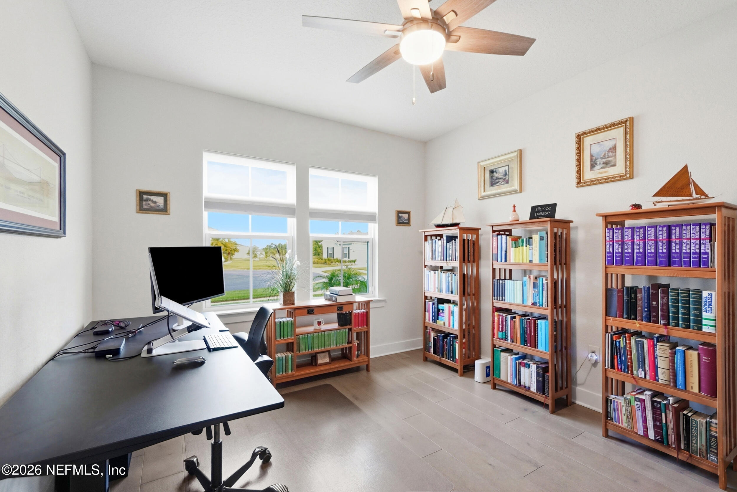 34 Red Rock Lane St. Johns, FL 32259 - Photo 7 of 71 a view of a workspace with a bookshelf and a window