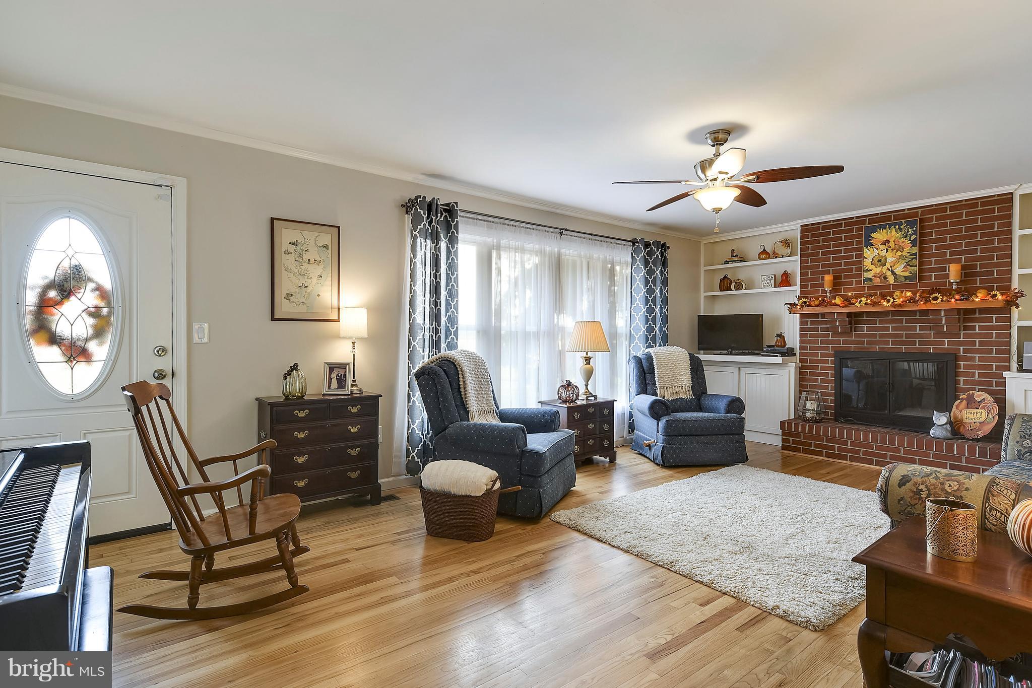 8720 Fairlee Road Chestertown, MD 21620 - Photo 6 of 27 Living room w wood burning fireplace & wood floors