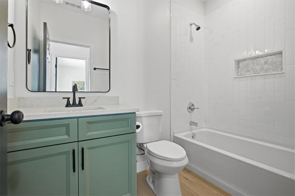4911 Lower Jersey Road Oxford, GA 30054 - Photo 28 of 56 a bathroom with a sink a toilet and shower