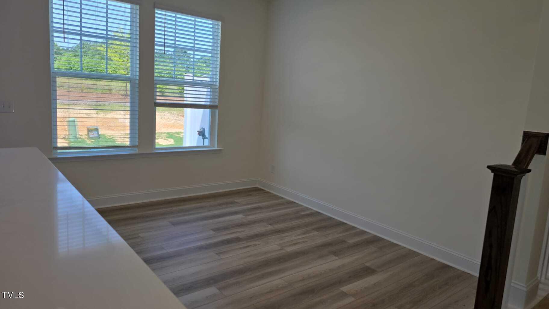 Undisclosed Address Raleigh, NC 27610 - Photo 8 of 12 a view of a room with wooden floor and window