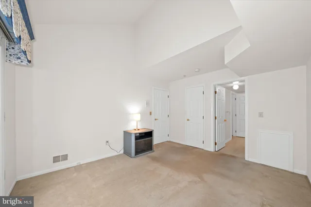 a view of empty room with fireplace