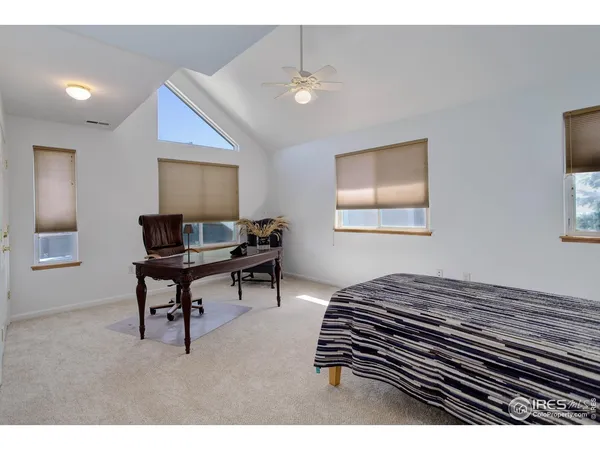 a bedroom with furniture and a window