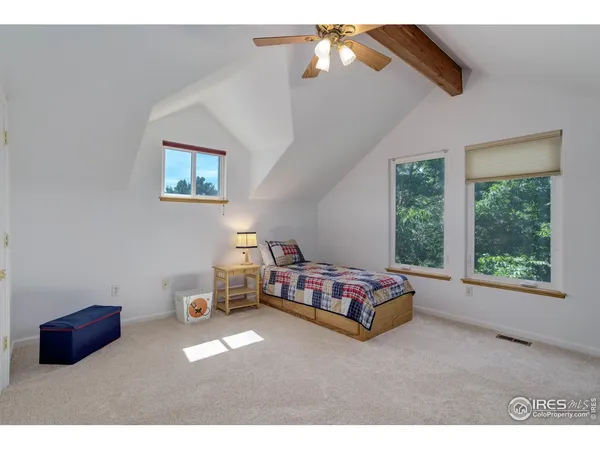 a bedroom with furniture and a window