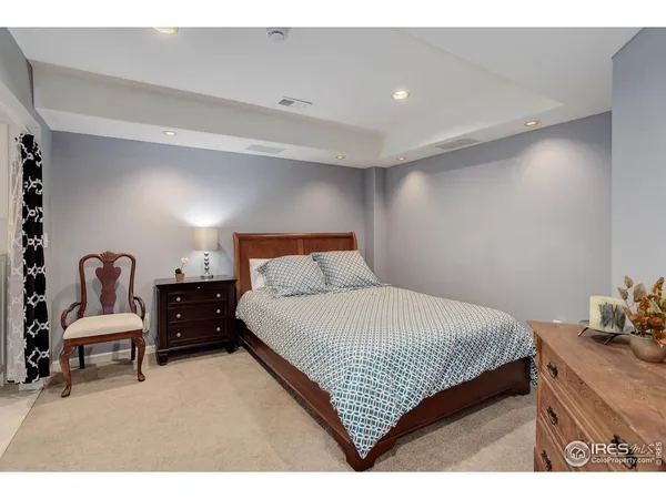 a bedroom with a bed and chair