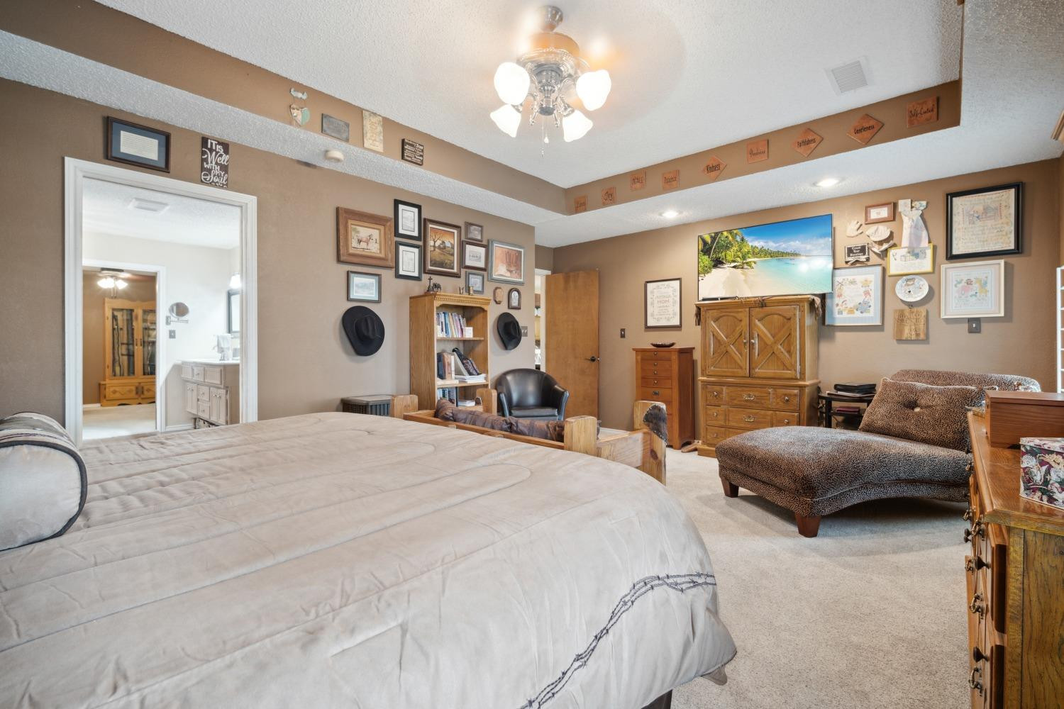 9002 Woodrow Road Wolfforth, TX 79382 - Photo 11 of 48 a bedroom with bed and furniture