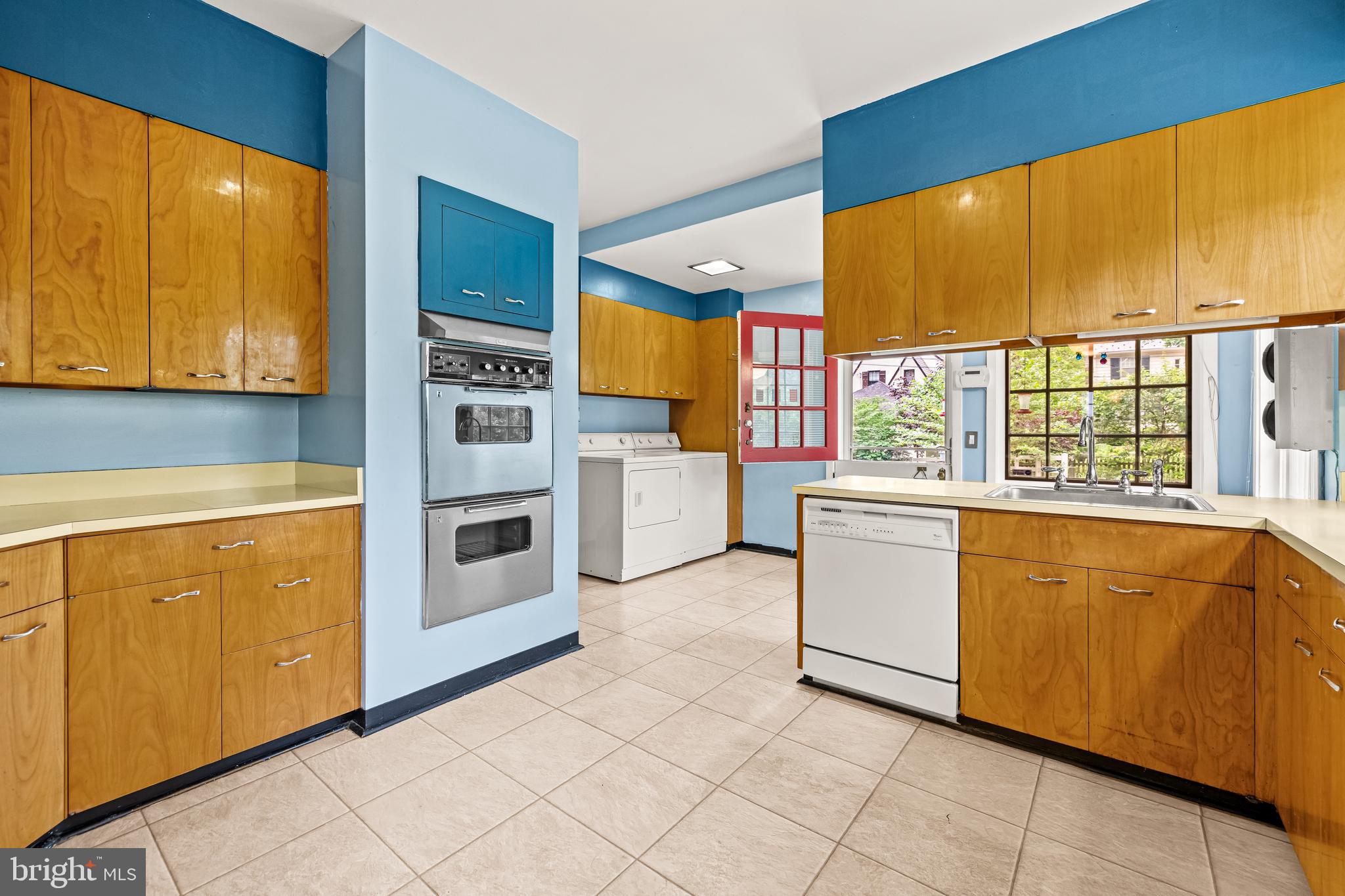 4406 Norwood Road Baltimore, MD 21218 - Photo 25 of 74 a kitchen with stainless steel appliances a stove and more cabinets