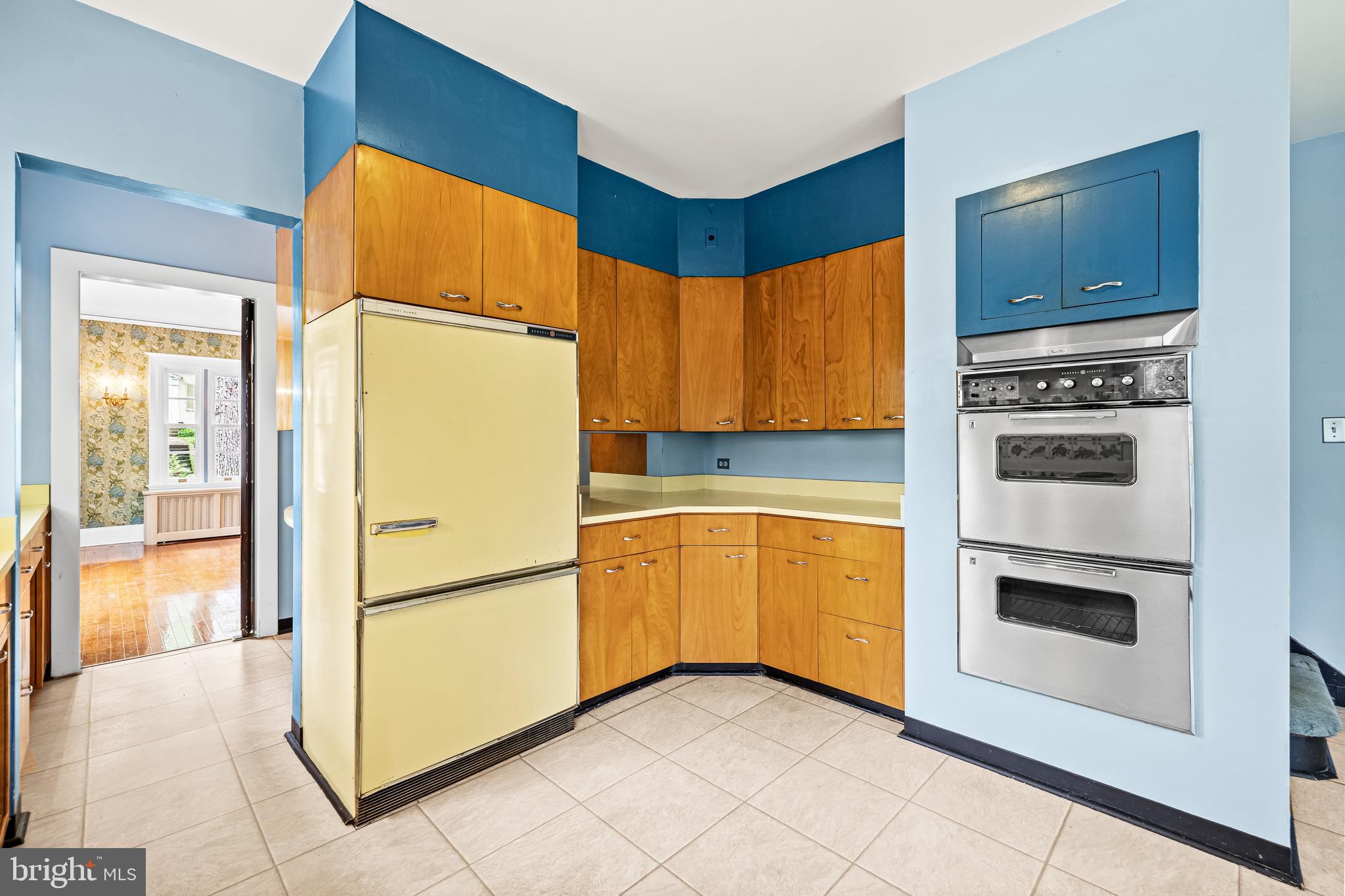 4406 Norwood Road Baltimore, MD 21218 - Photo 28 of 74 a kitchen with a refrigerator and a stove