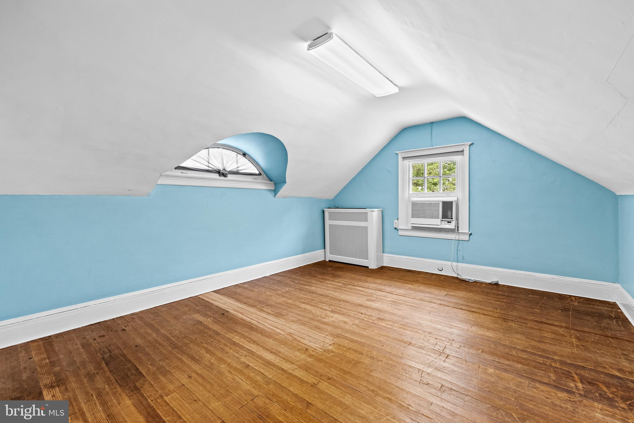 4406 Norwood Road Baltimore, MD 21218 - Photo 52 of 74 wooden floor in an empty room with a window