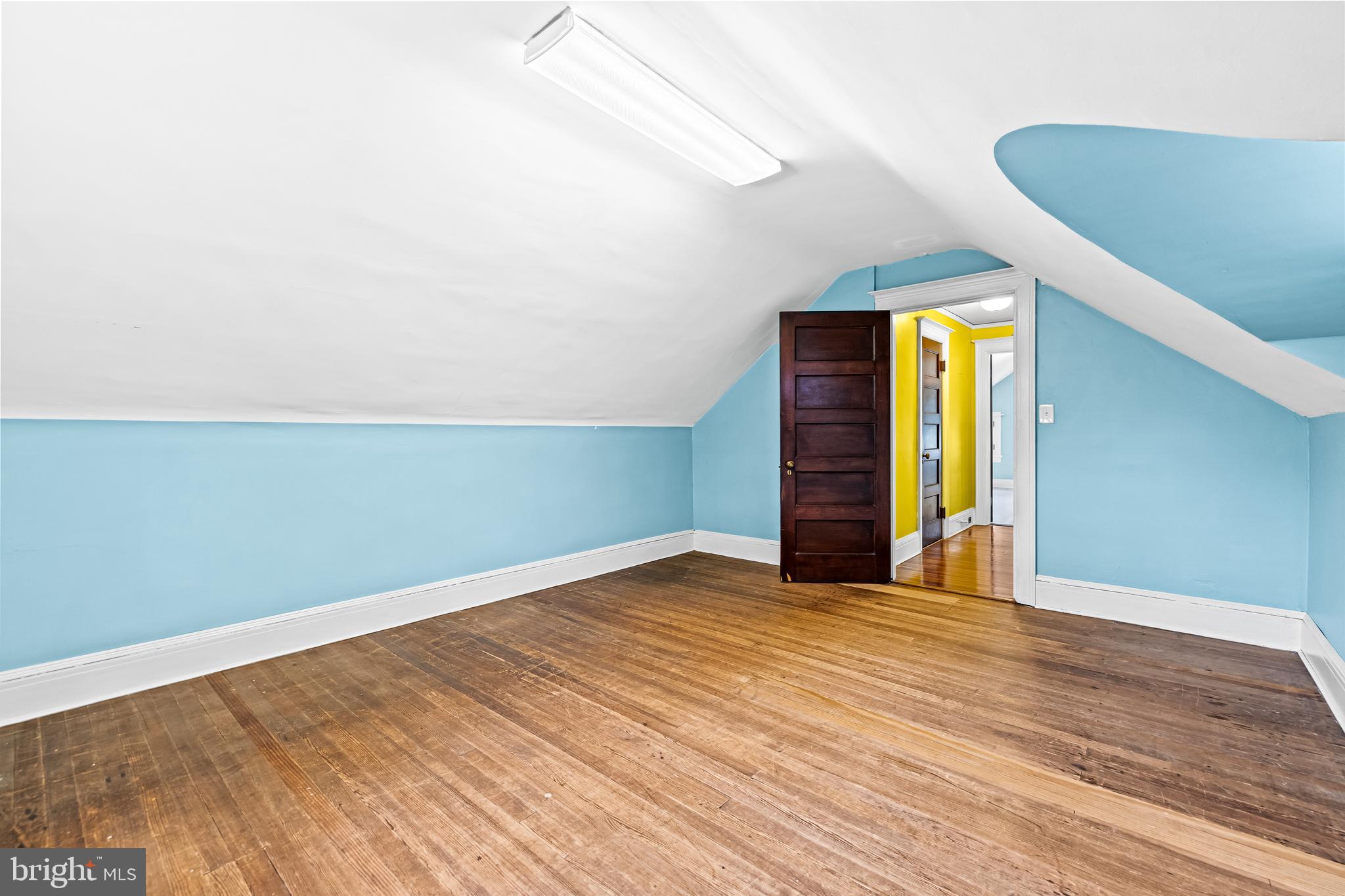 4406 Norwood Road Baltimore, MD 21218 - Photo 53 of 74 a view of empty room with wooden floor and fan