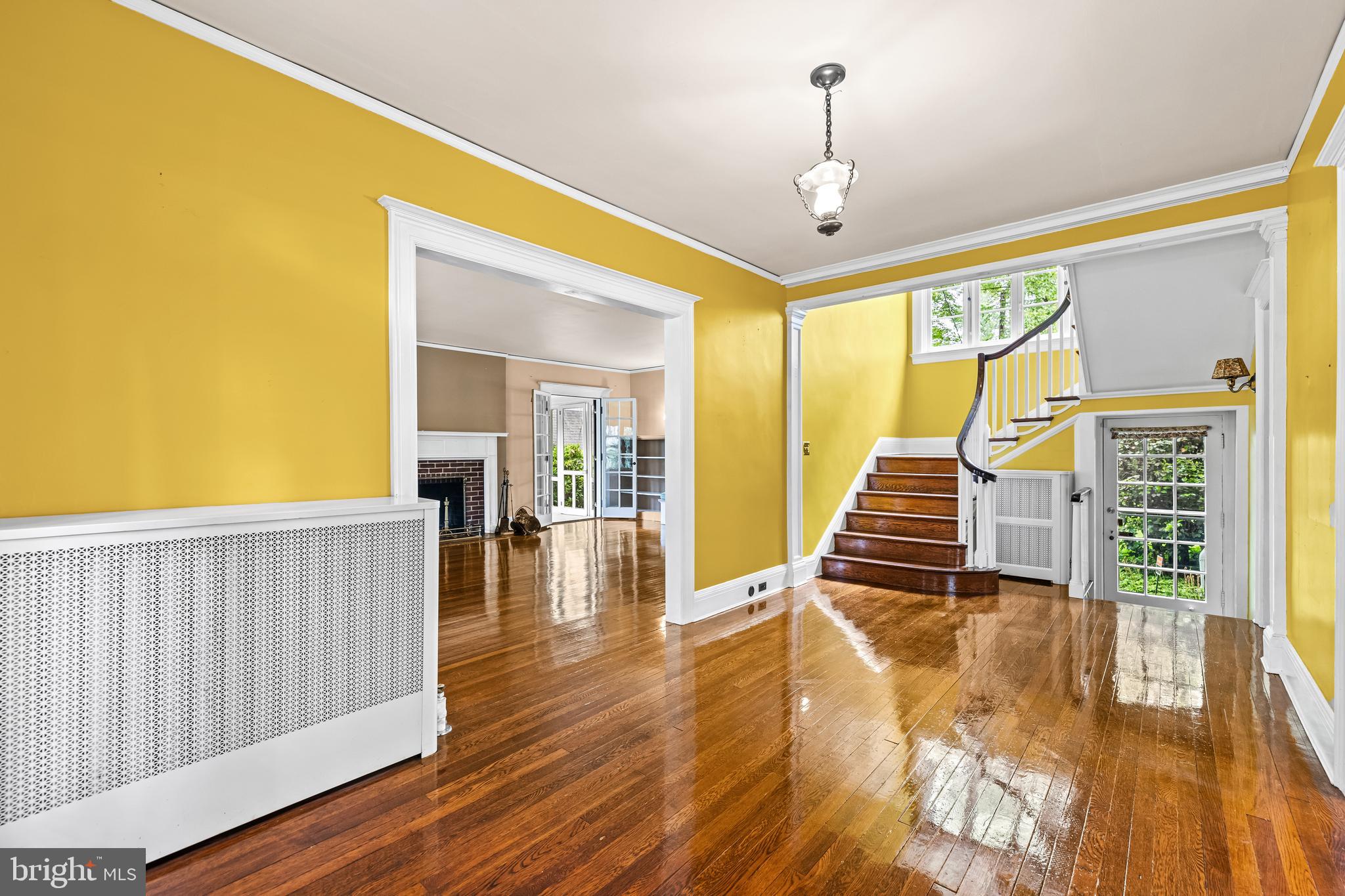 4406 Norwood Road Baltimore, MD 21218 - Photo 10 of 74 a view of a room with wooden floor fireplace and windows