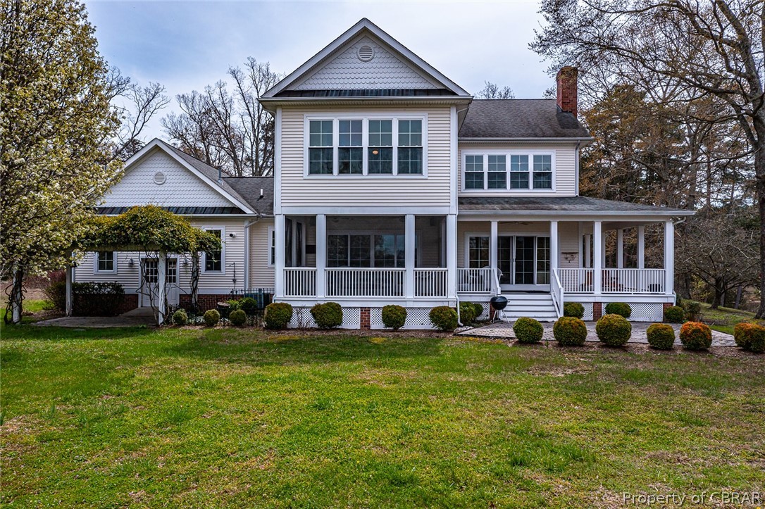 507 Sunnybank Road Reedville, VA 22539 - Photo 9 of 48 View of front facade featuring a front lawn and covered porch