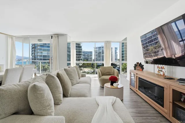 a living room with furniture fireplace and flat screen tv