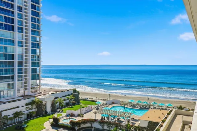 a view of a chairs and bench in front of a building