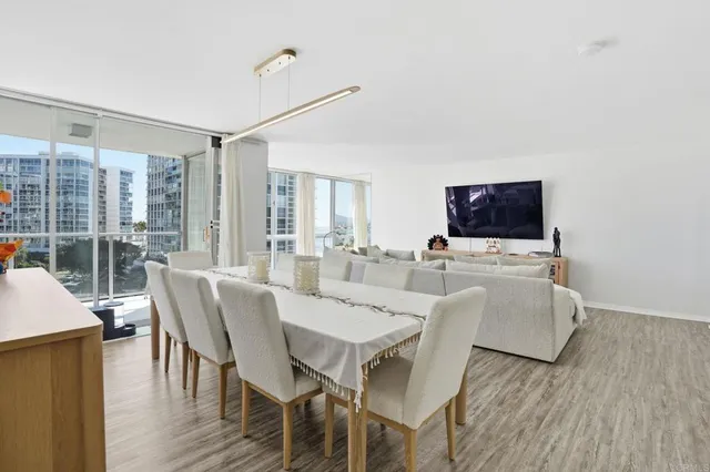 a view of a dining room with furniture and wooden floor