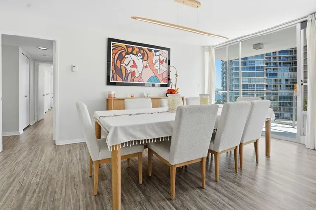 a view of a dining room with furniture window and wooden floor