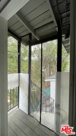 a view of a door and a window