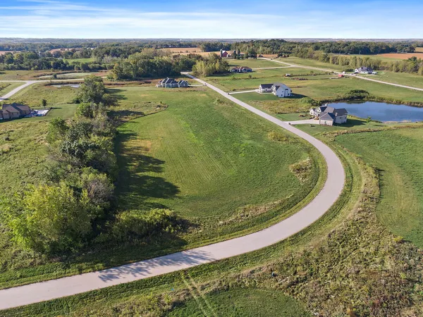 a view of a lake with a yard