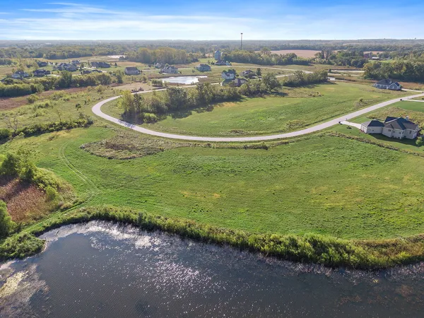 an aerial view of a houses with an outdoor space