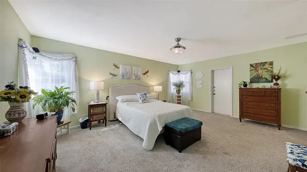 a living room with furniture window and wooden floor
