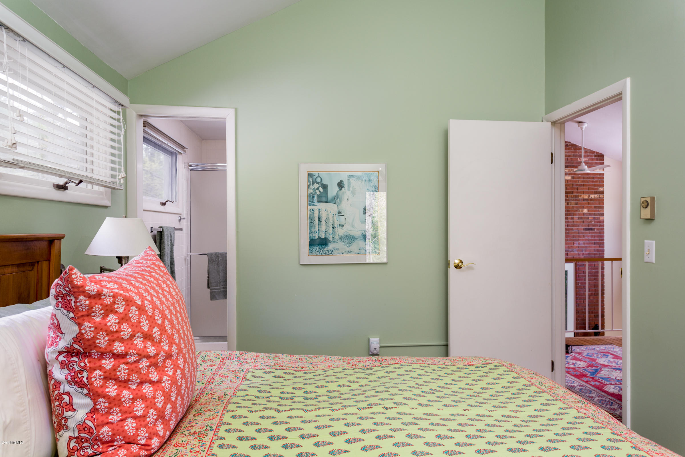 4 Castle Hill Road Stockbridge, MA 01262 - Photo 14 of 20 a bedroom with a bed and a lamp on dresser