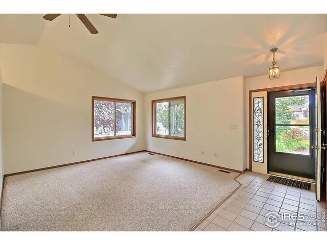 a kitchen that has a sink cabinets and a window