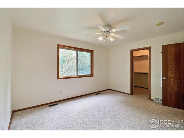 a kitchen with a refrigerator and a stove top oven