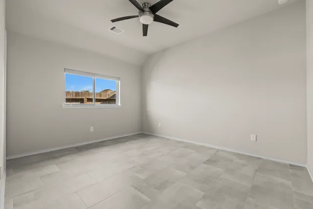a view of a house with backyard and porch