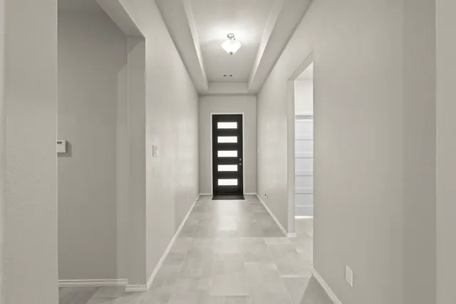 a view of a hallway with an entryway